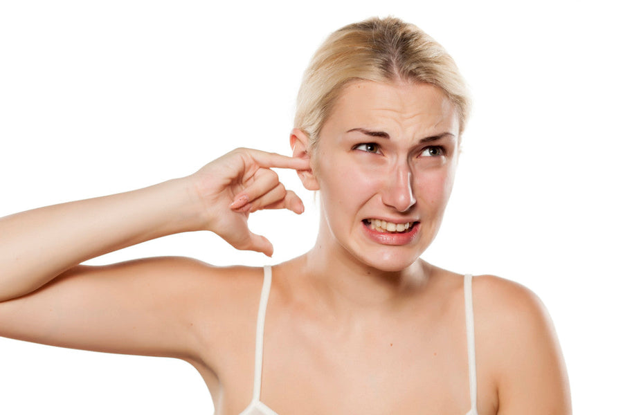 What are the symptoms of an earwax plug?